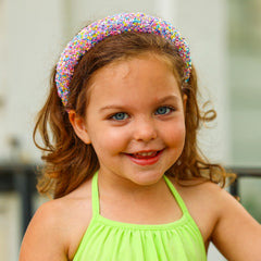FROG SAC headband worn by a child in lifestyle setting adding playful confidence