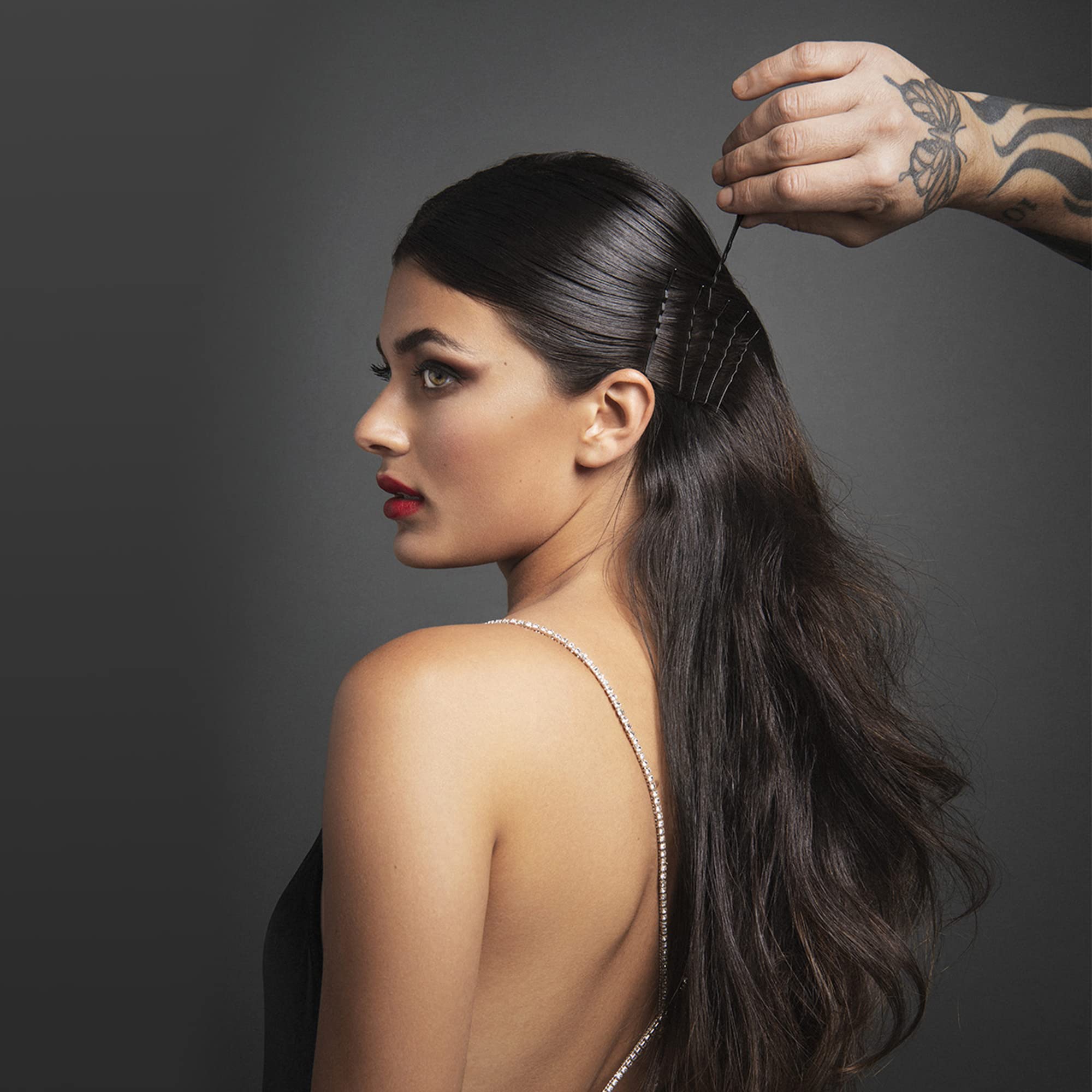 Fromm pins securing an elegant updo for lasting hold