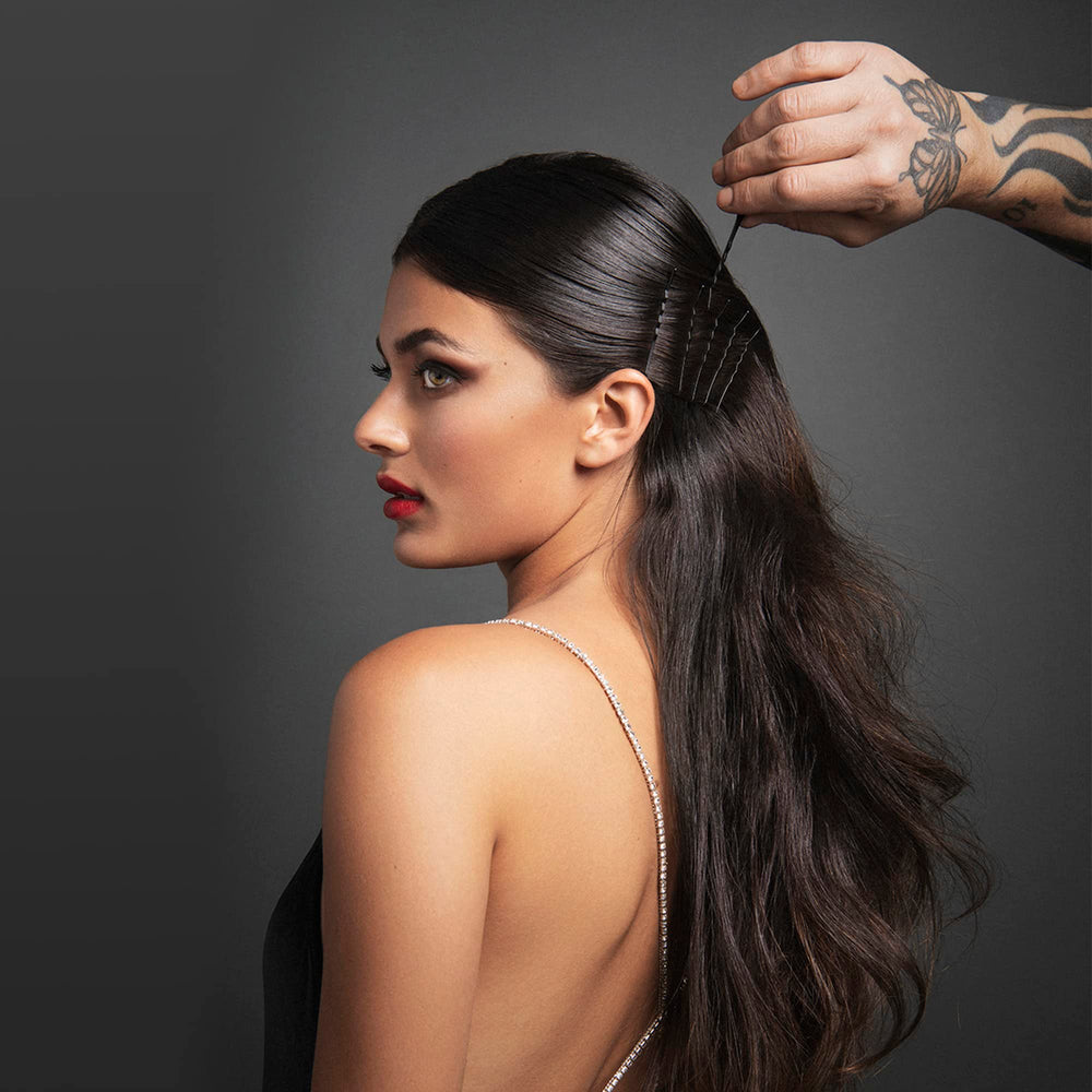 Fromm pins securing an elegant updo for lasting hold