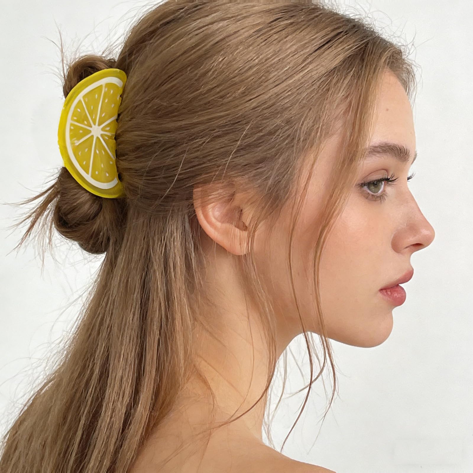 FRUZJAY lemon clip in a beach outfit setting showing summer fashion accent benefit