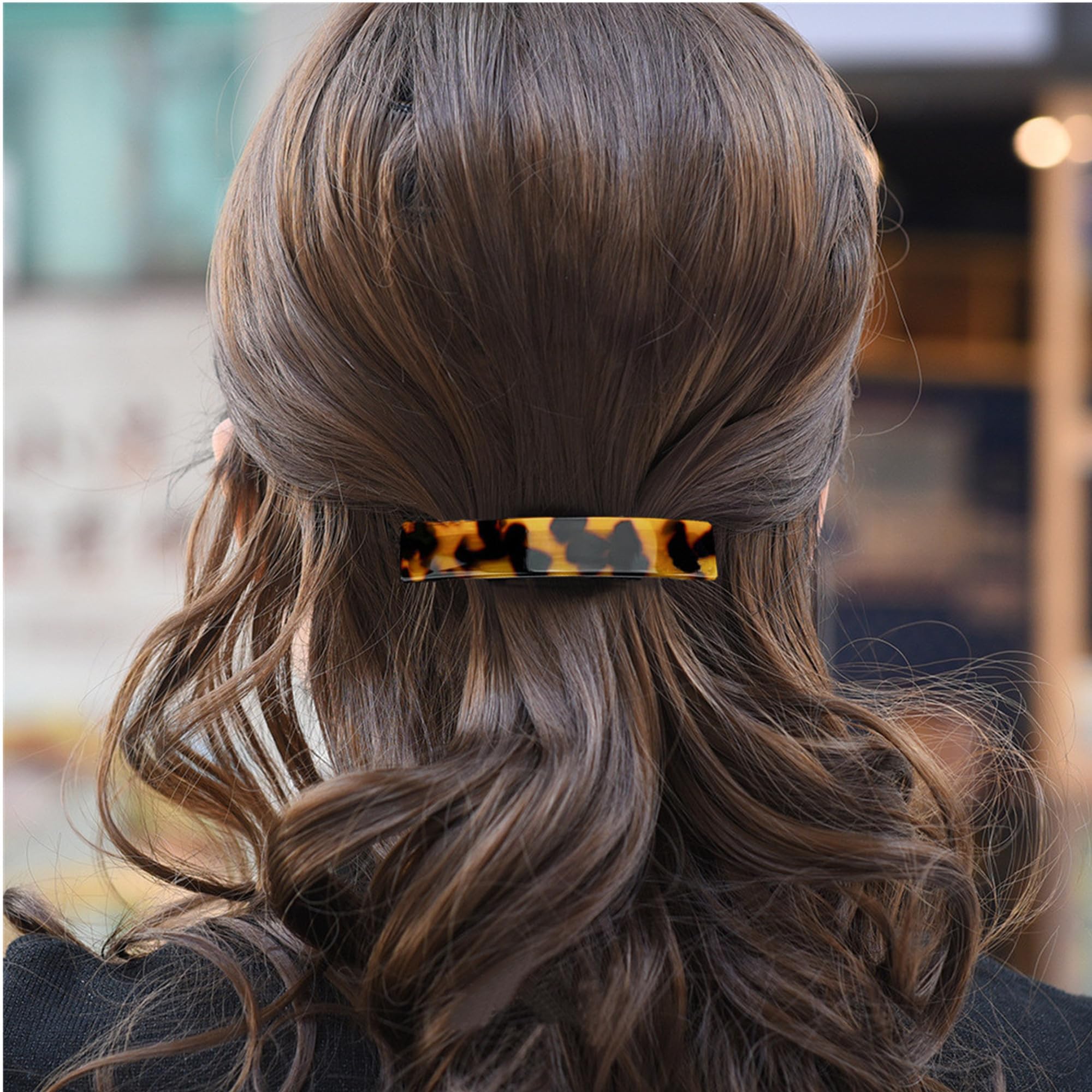 Fsmiling close-up of acetate tortoise pattern, highlights premium texture and shine