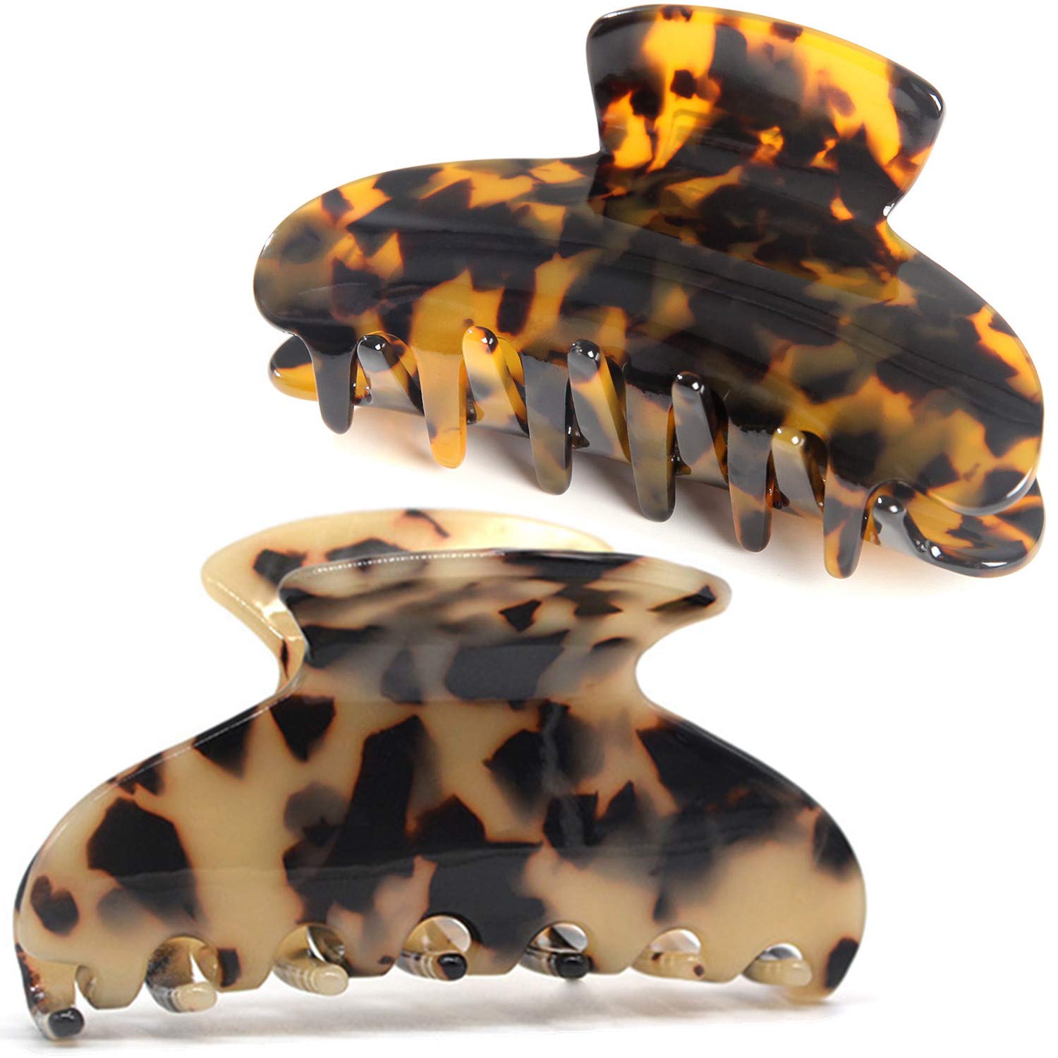 Fsmiling front view of two tortoise claw clips showing pattern and compact shape for styling