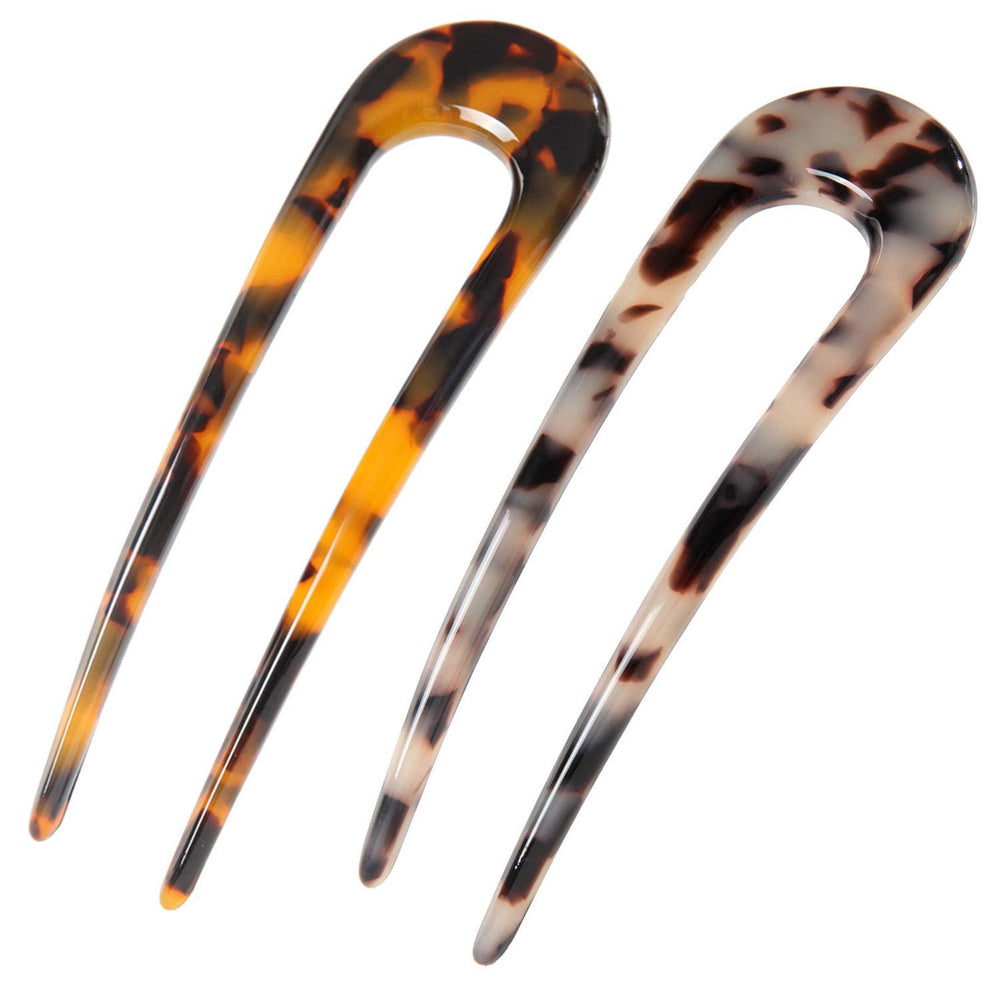 Fsmiling front view of two tortoiseshell pins showing shape and finish benefits