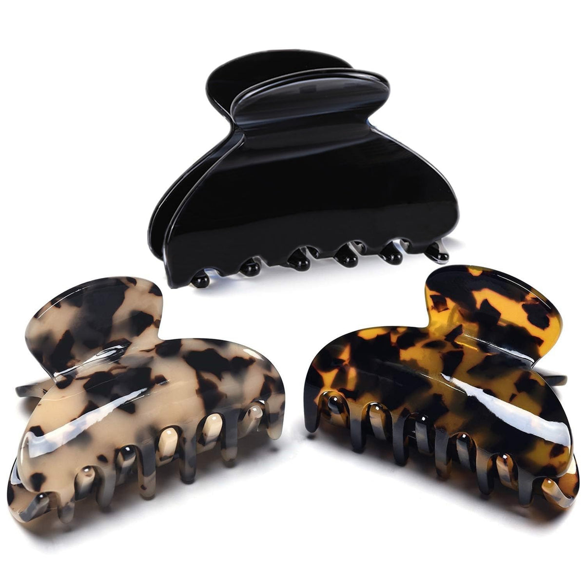 Fsmiling front view of three tortoise and leopard clips showing patterns and finish