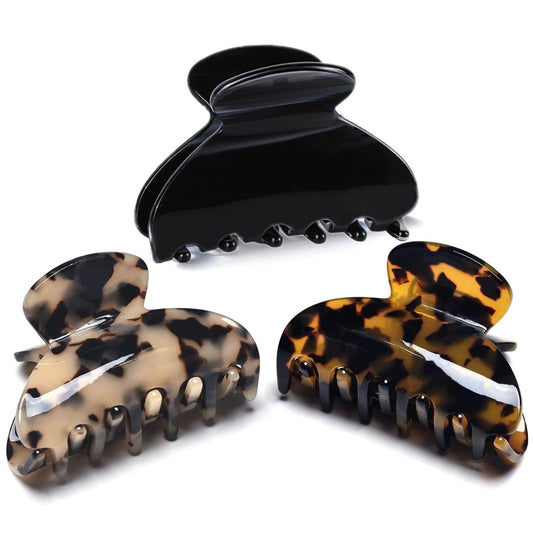 Fsmiling front view of three tortoise and leopard clips showing patterns and finish
