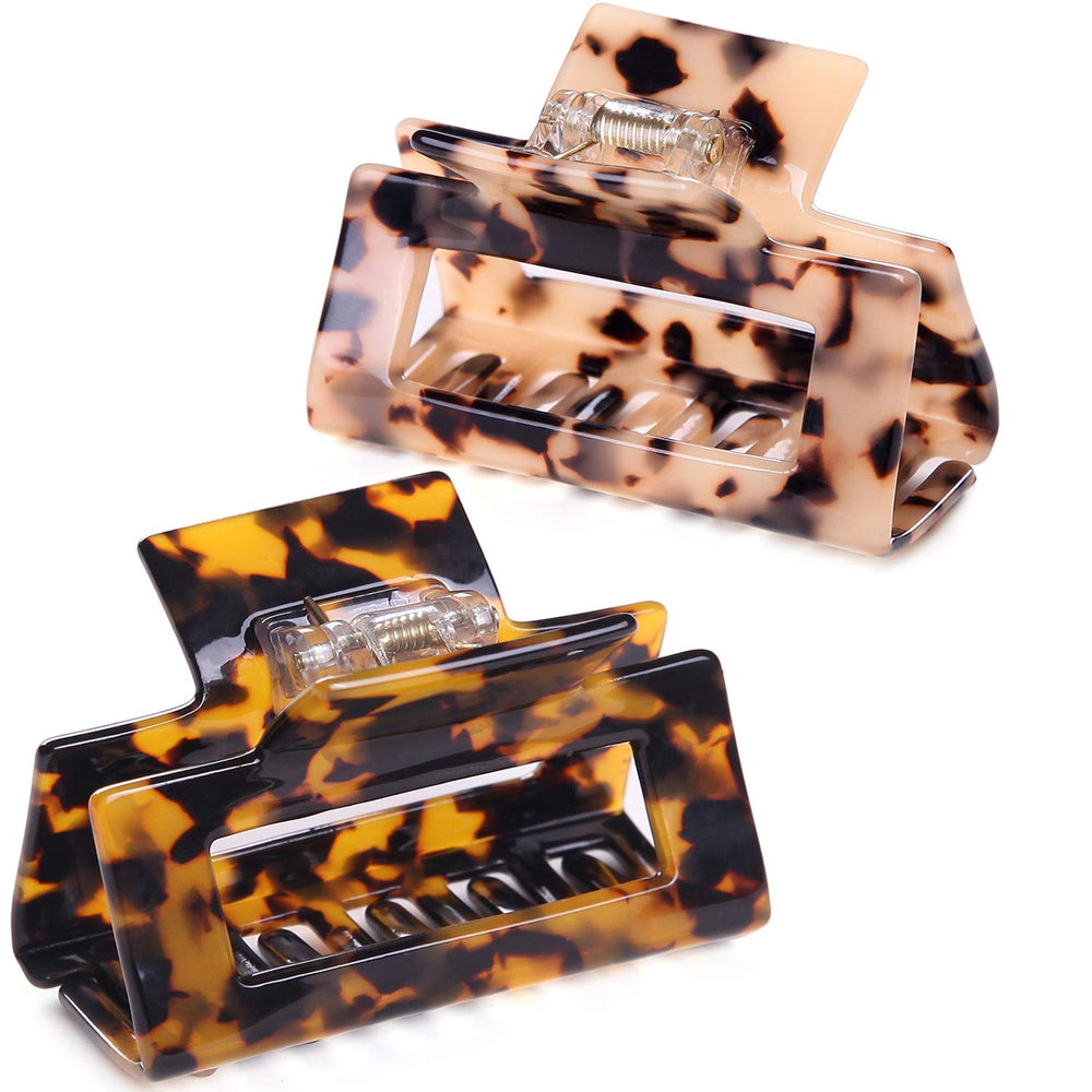Fsmiling front view of two jaw clips showing tortoise and leopard prints for stylish hold