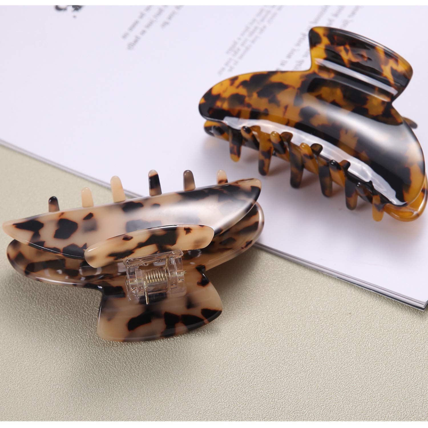 Fsmiling clip next to a coin showing 9.5 cm size for accurate scale and packing