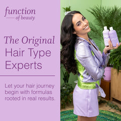 Function of Beauty styled wavy hair in bathroom showcasing defined, frizz-reduced waves