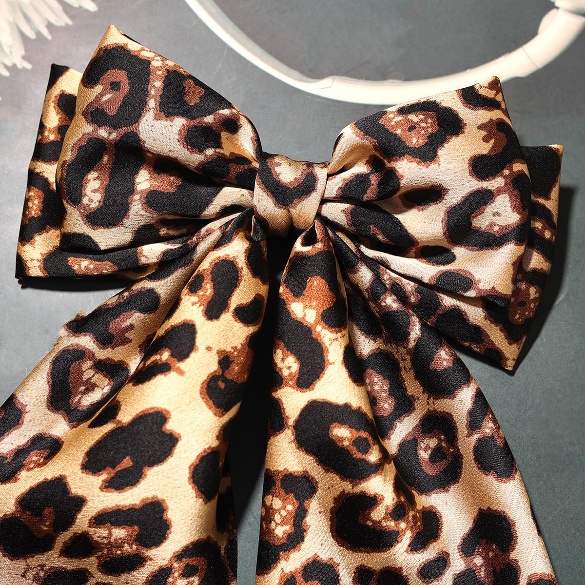 Furling Pompoms worn in a ponytail demonstrating stylish look and easy styling benefit