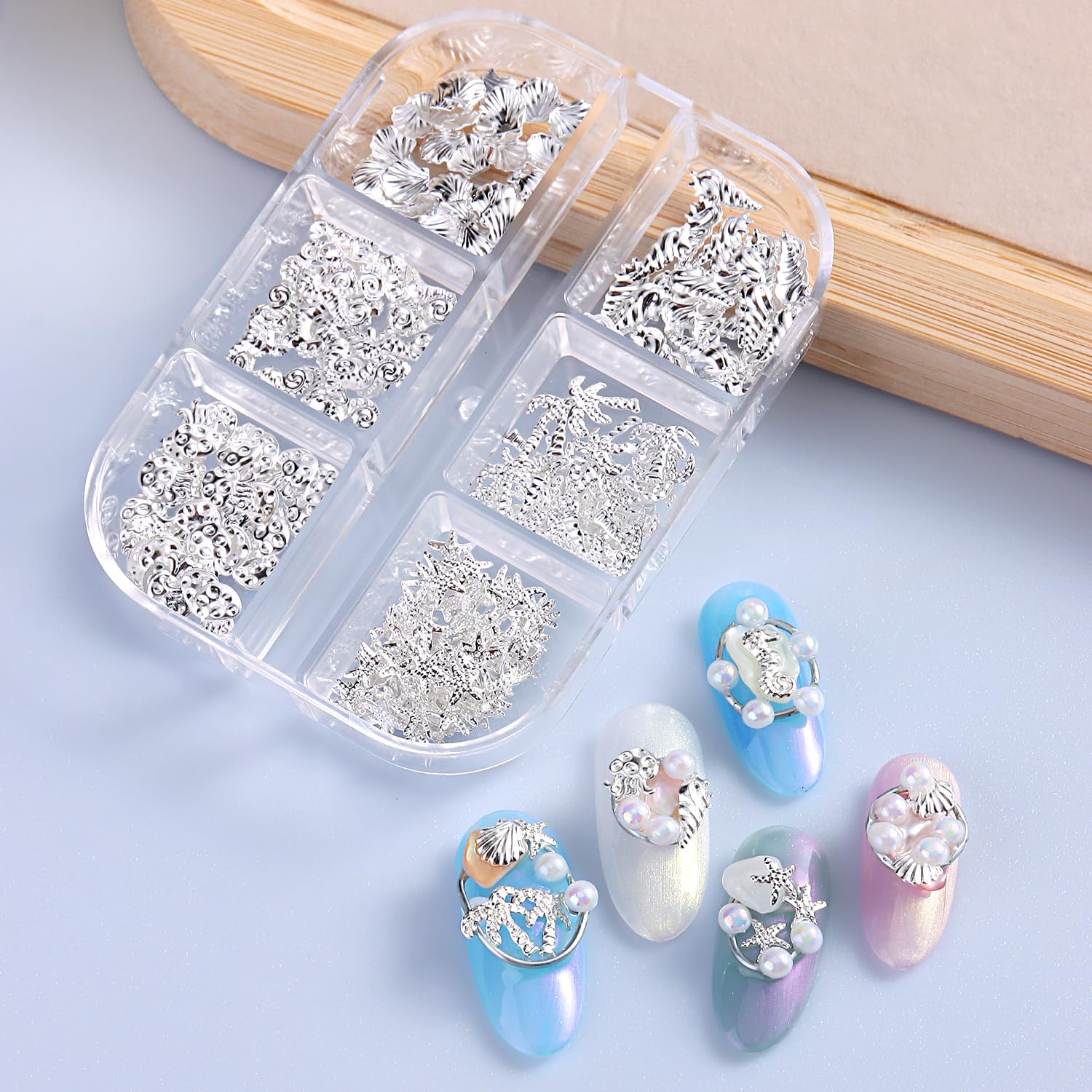 Furtherpretty beach-themed manicure on hand, wearable summer style benefit