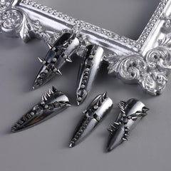 Furtherpretty studs next to coin showing size scale and application options