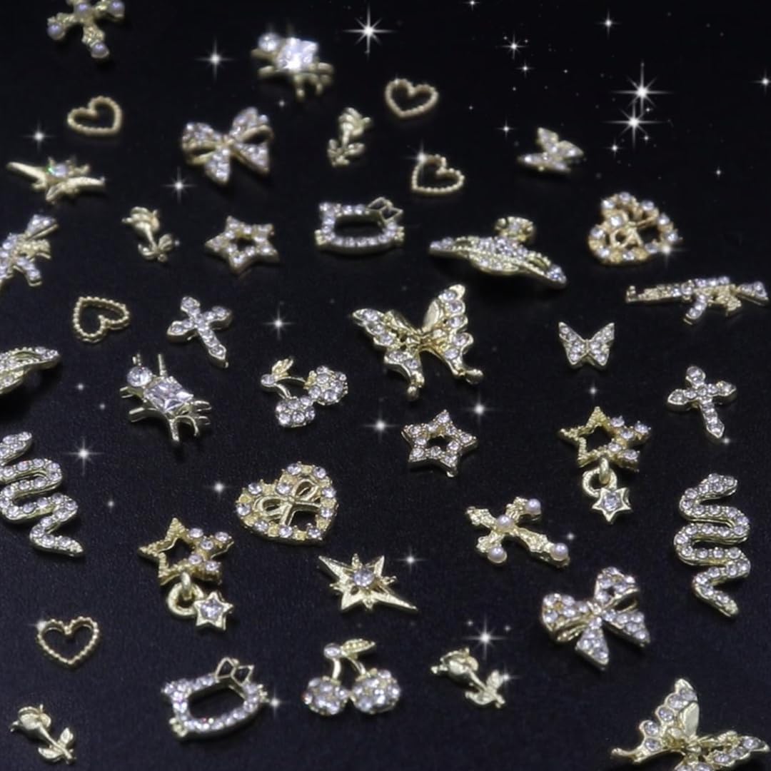 Ganepwns lifestyle manicure with charms illustrating a finished glamorous look