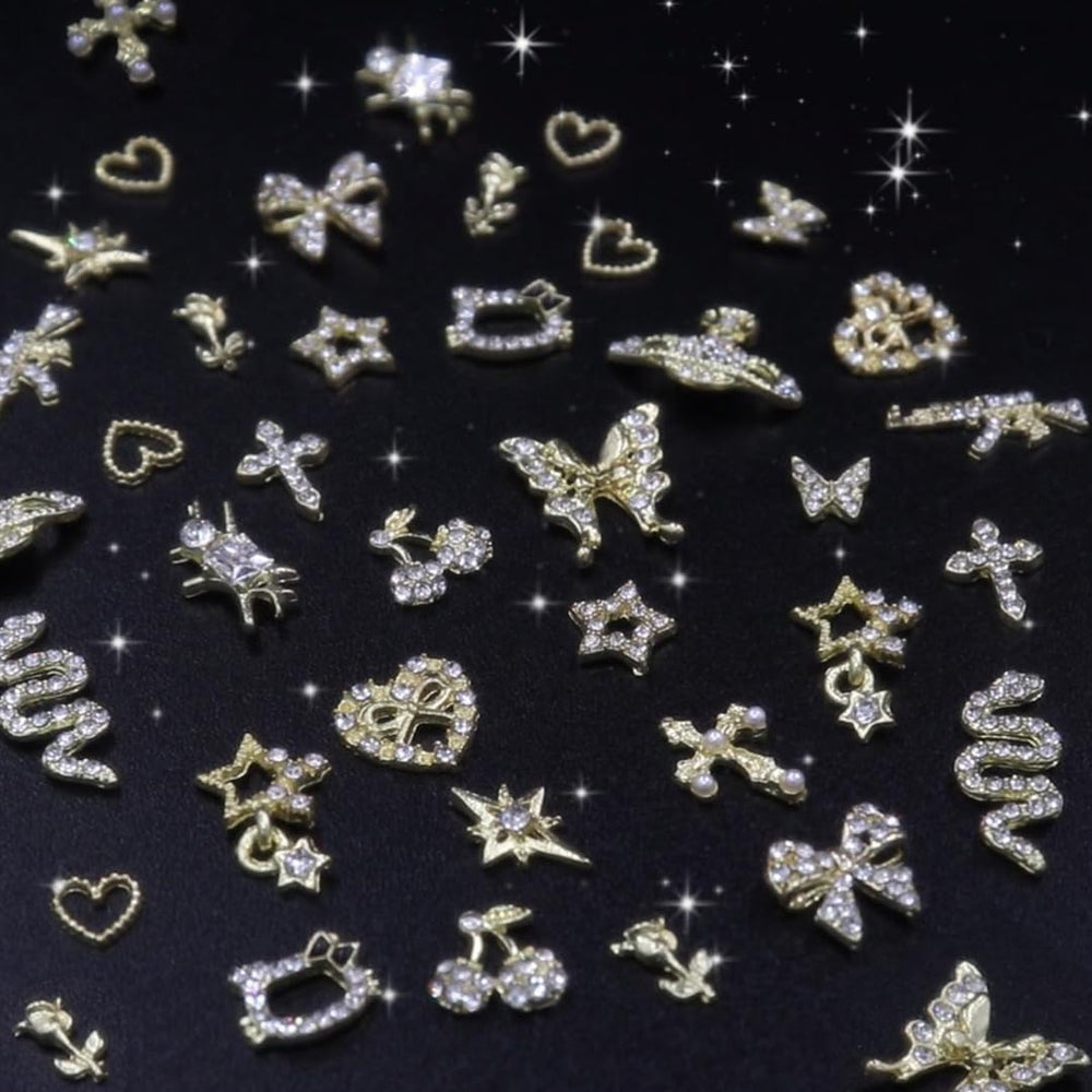 Ganepwns lifestyle manicure with charms illustrating a finished glamorous look