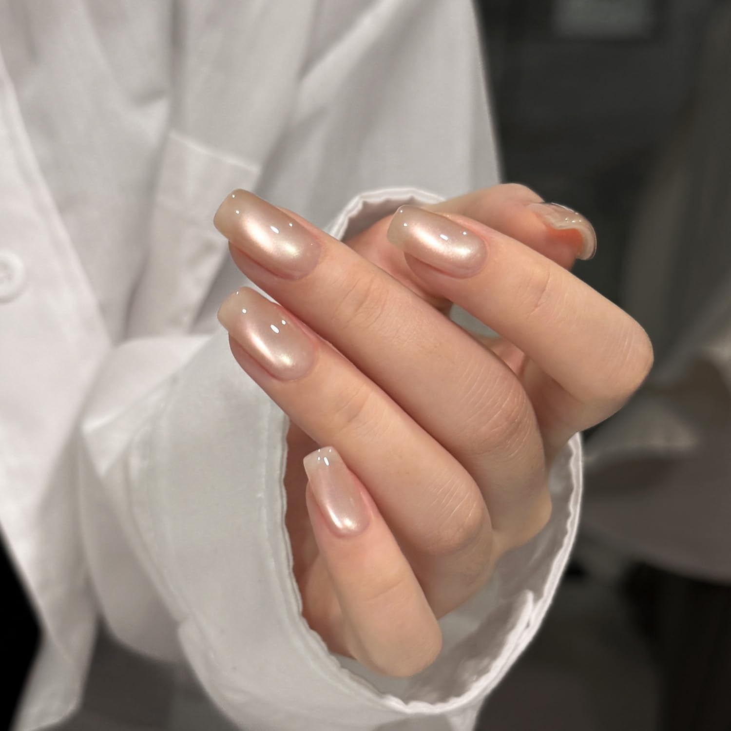 GAOY nail swatch on finger showing reflective cat eye band for shimmer