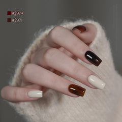 GAOY on hand model showing cured dark green brown manicure durability