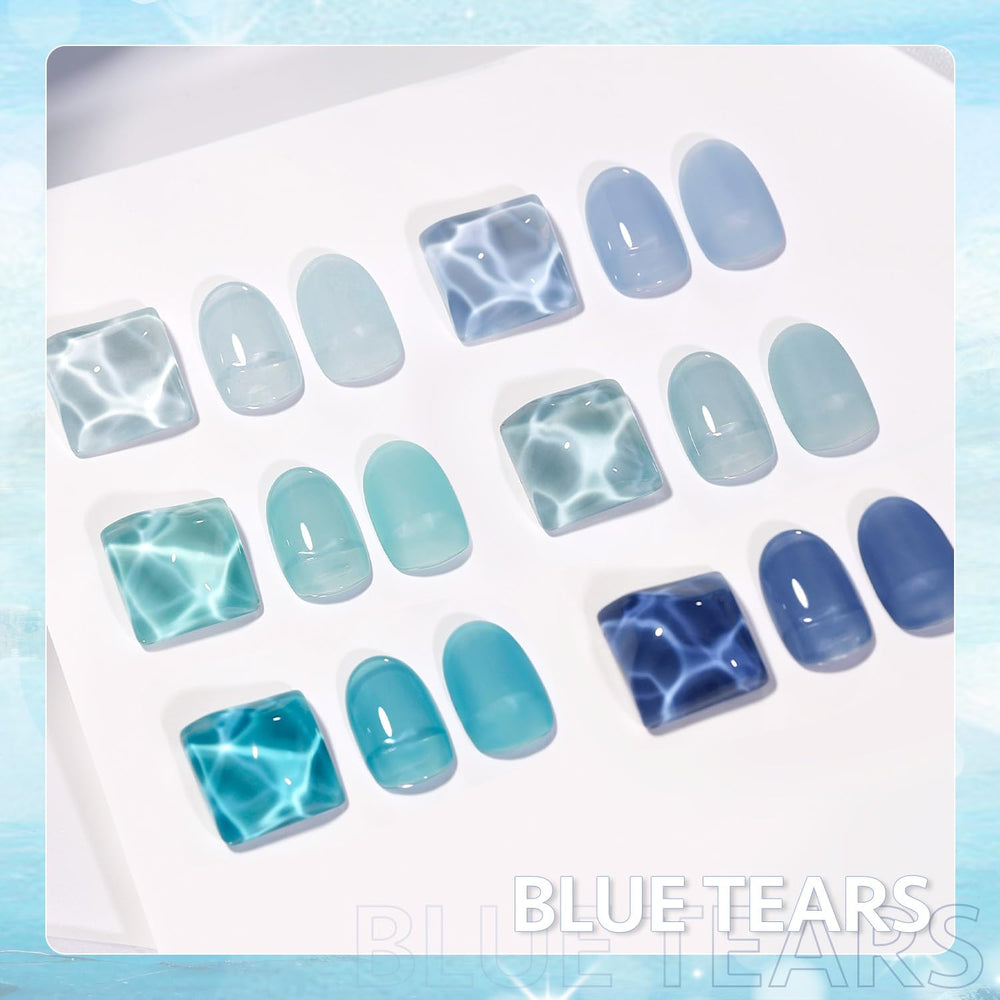 GAOY jelly blue manicure in a beach setting highlighting wearable, glassy seaside tones