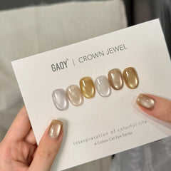 GAOY magnet held above uncured nail creating cat-eye line, precise design control