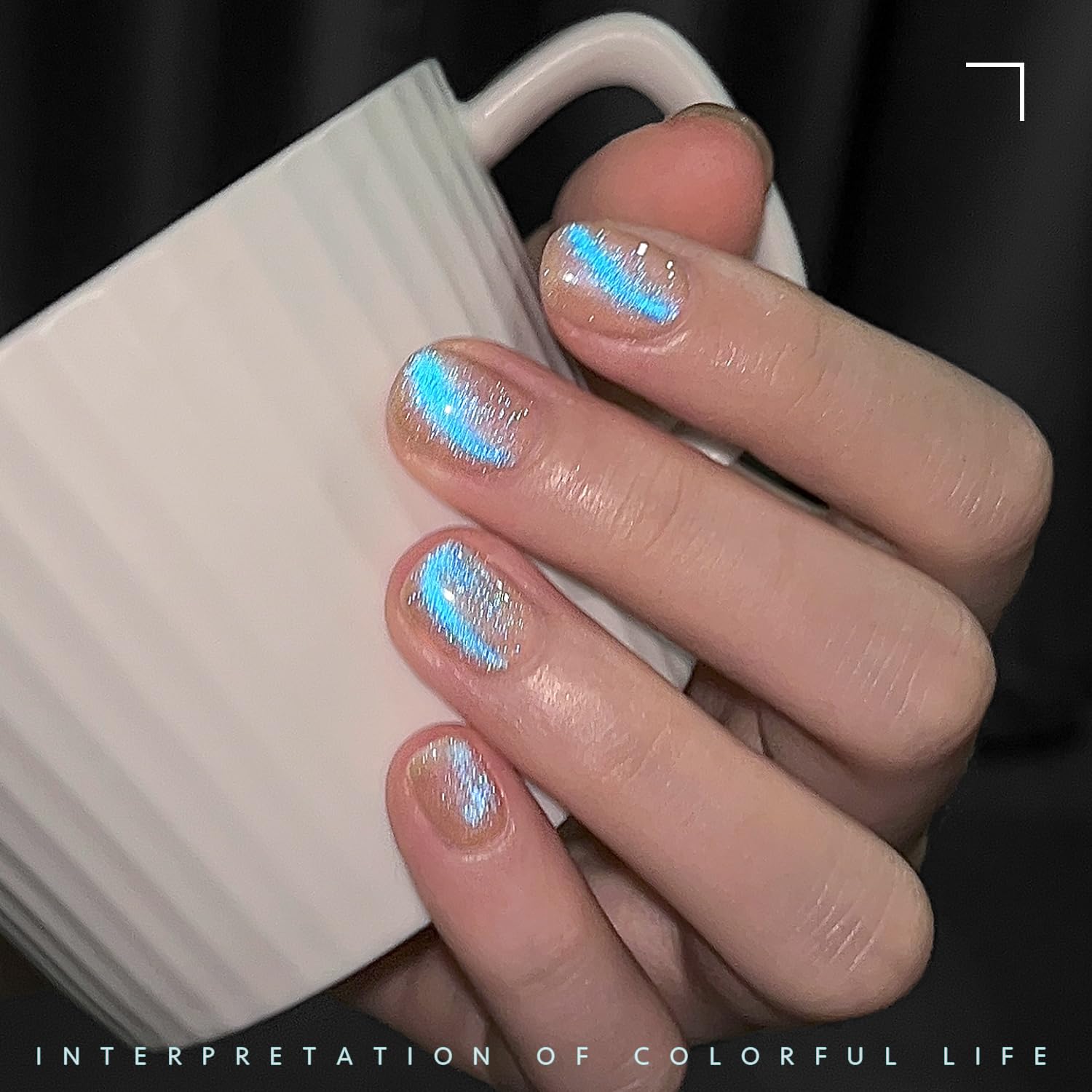 GAOY nails wearing Mermaid Tears showing dramatic blue shimmer benefit