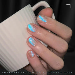 GAOY nails wearing Mermaid Tears showing dramatic blue shimmer benefit