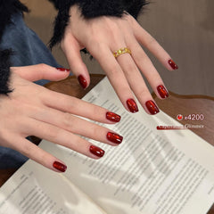 GAOY nail swatch on fingers showing crimson holographic shift benefit