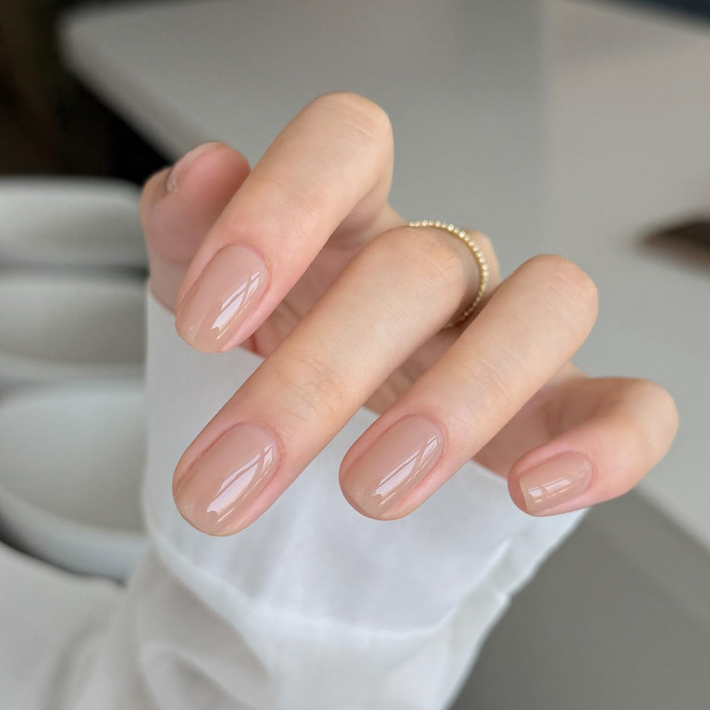GAOY nail polish applied on hands during home manicure, demonstrates wearable nude look