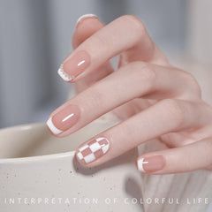 GAOY painted nails detail showing crisp white and black French lines for striking contrast