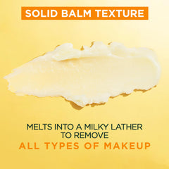 Garnier cleansing balm on fingers emulsifying with water for gentle rinseability benefit