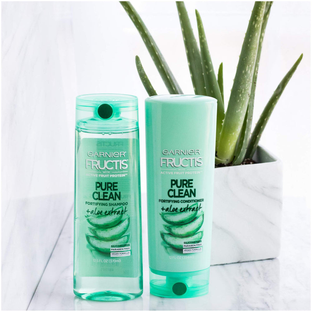Garnier Fructis with fresh aloe leaves highlighting soothing ingredient benefits