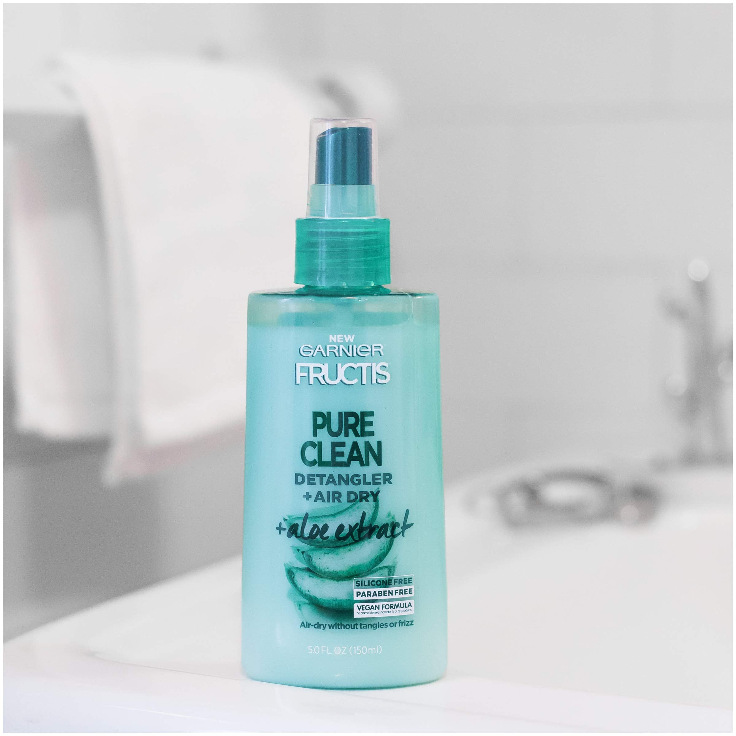 Garnier Fructis bottle in bathroom setting illustrating daily routine convenience