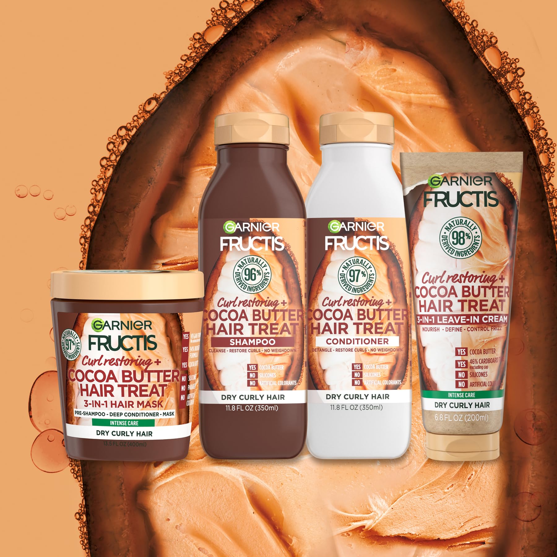 Garnier Fructis 200ml tube next to a hand for scale showing travel-friendly size and daily use benefit