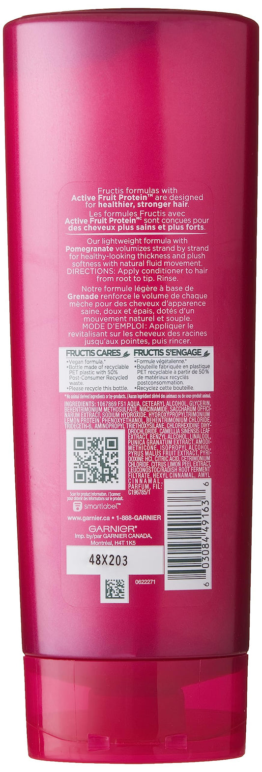 Garnier Fructis conditioner applied in hair demonstrating lightweight volumizing effect and softer texture