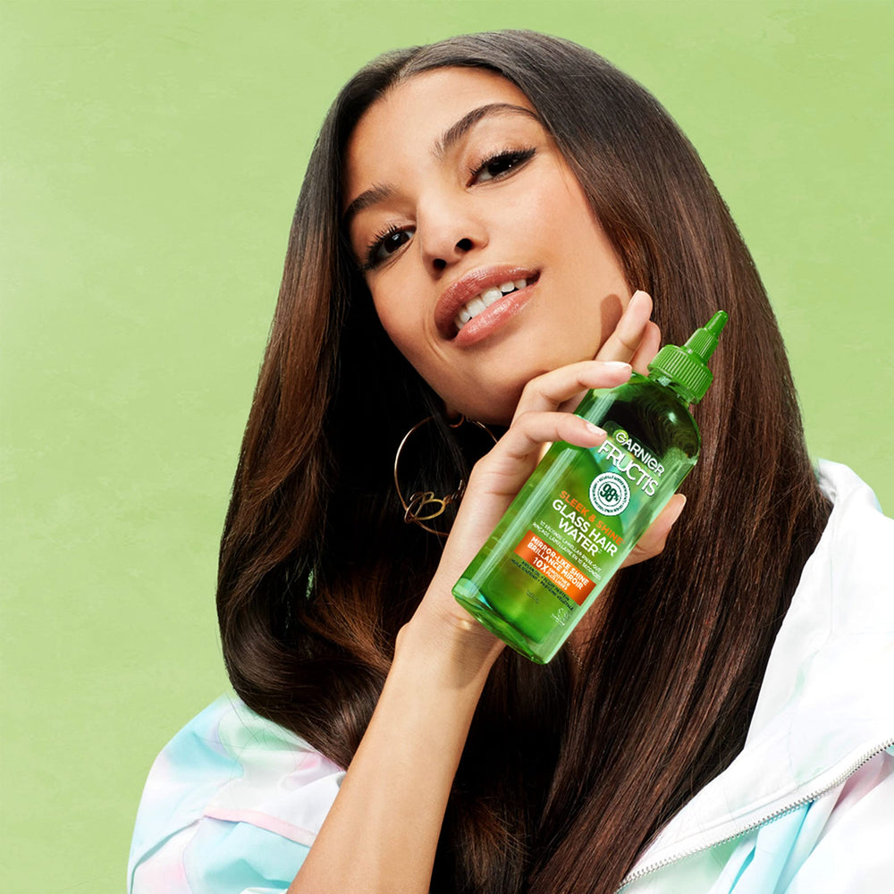 Styled glossy hair in lifestyle shot showcasing Garnier reflective shine benefit