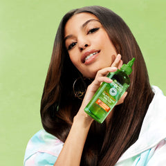 Styled glossy hair in lifestyle shot showcasing Garnier reflective shine benefit