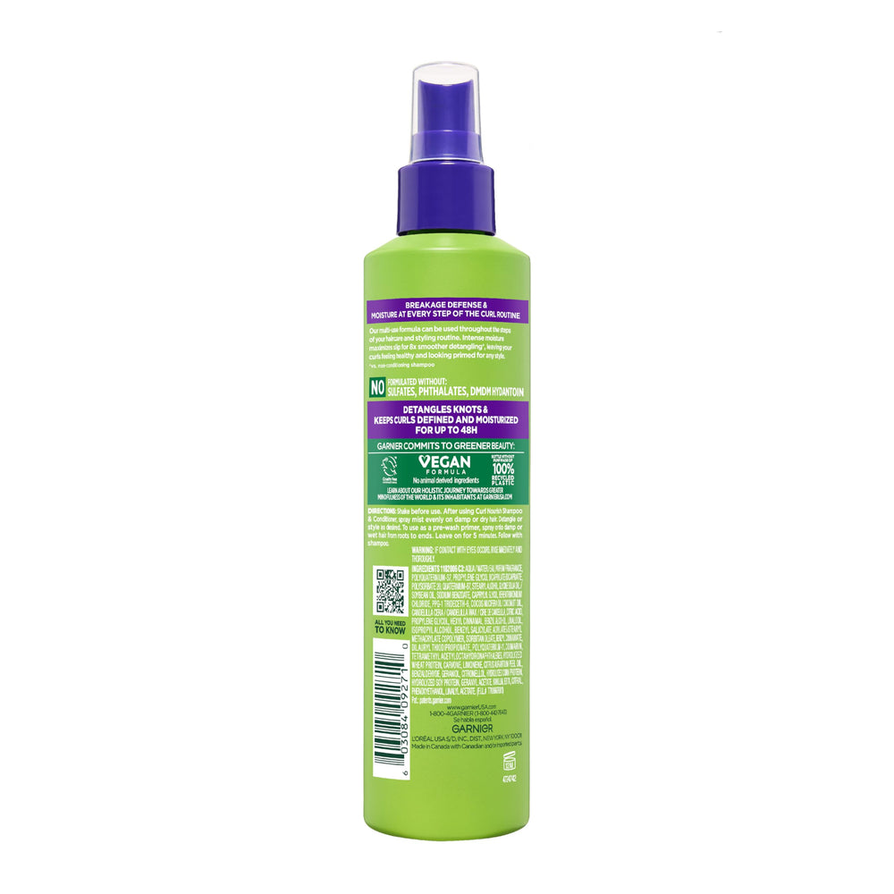 Garnier Fructis on model with defined curls showing moisturized results