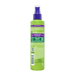 Garnier Fructis on model with defined curls showing moisturized results