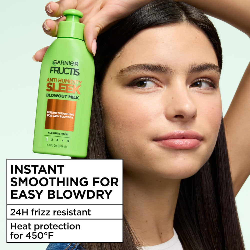 Garnier Fructis milk texture dispensed on hand for lightweight styling benefit
