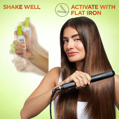 Garnier Fructis bottle next to hand for size and scale convenience benefit