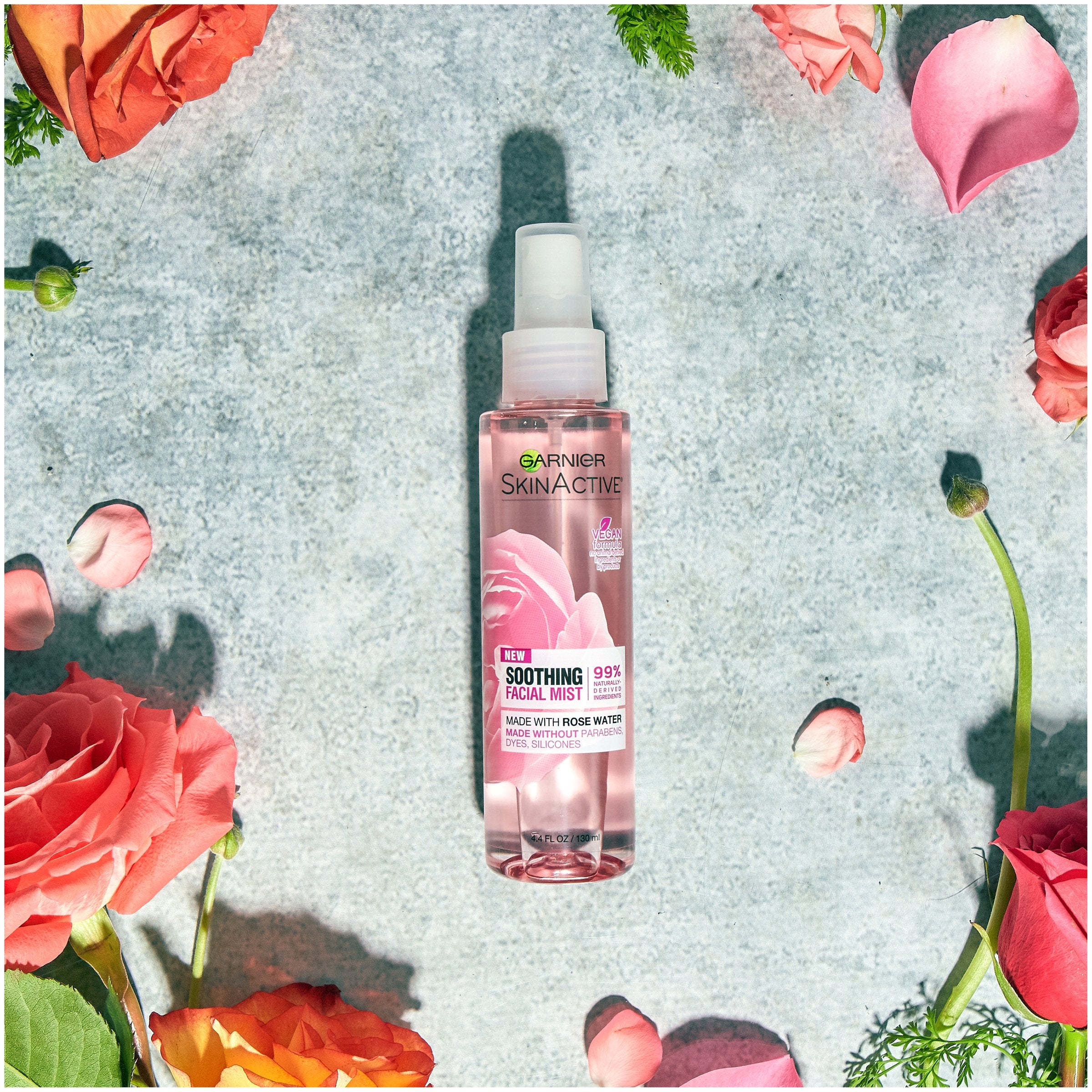 Garnier model spritzing mist to refresh skin and revive makeup quickly