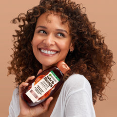 Garnier Whole Blends on bathroom vanity suggesting daily styling routine