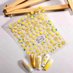 GCSQW lemon sticker applied to acrylic nail demonstrating polished finish and lively design