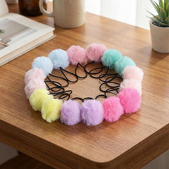 Gegraterwa pom pom attached to a bag offering decorative customization
