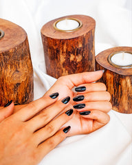 Gelish swatch on fingernails showing even Black Shadow color and salon finish benefit