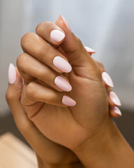 Gelish bottle beside LED lamp showing fast curing benefit under light