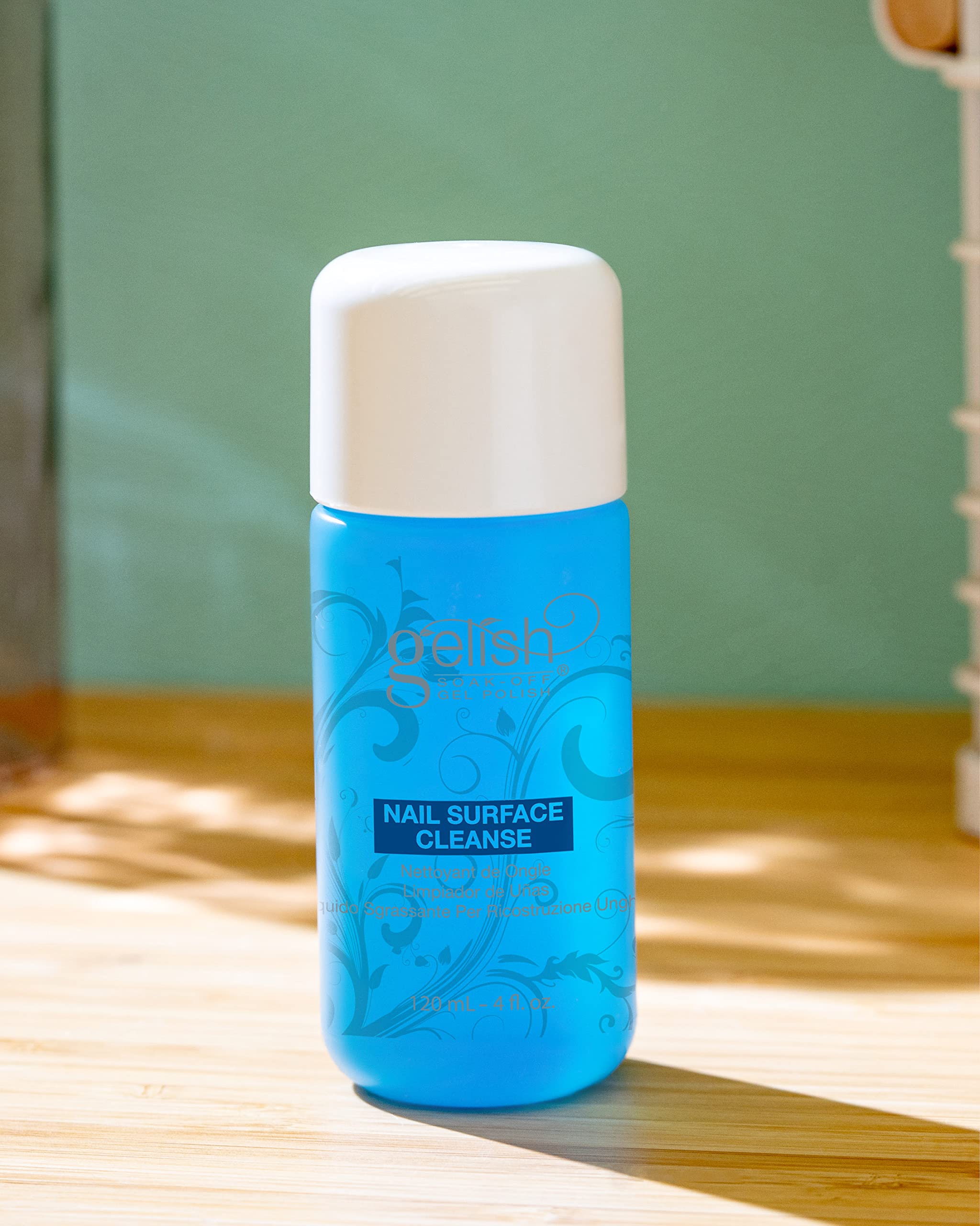 Gelish product in use wiping cured nail to remove tacky residue for high shine