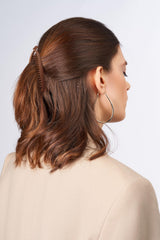 Generic banana clip in styled ponytail demonstrating lift and retro look
