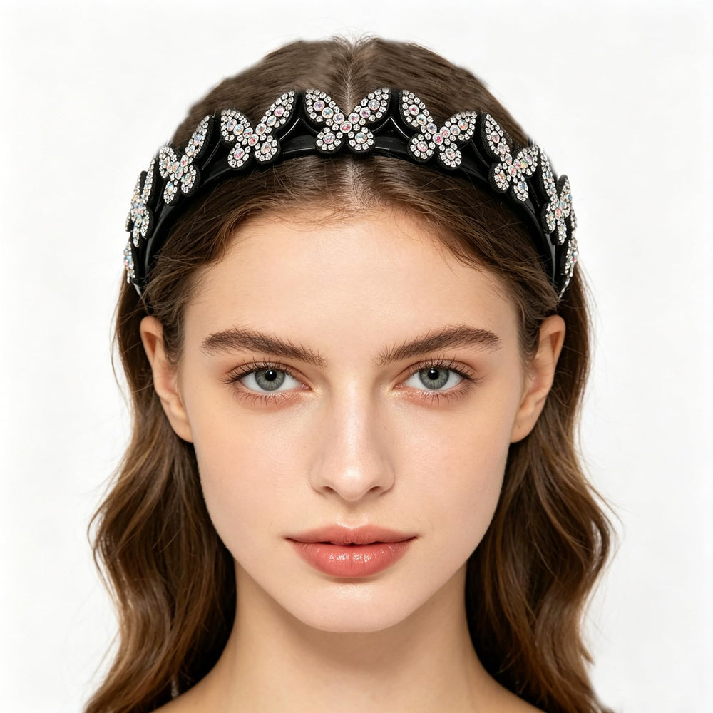Generic butterfly headband held in hand to show compact size and lightweight benefit