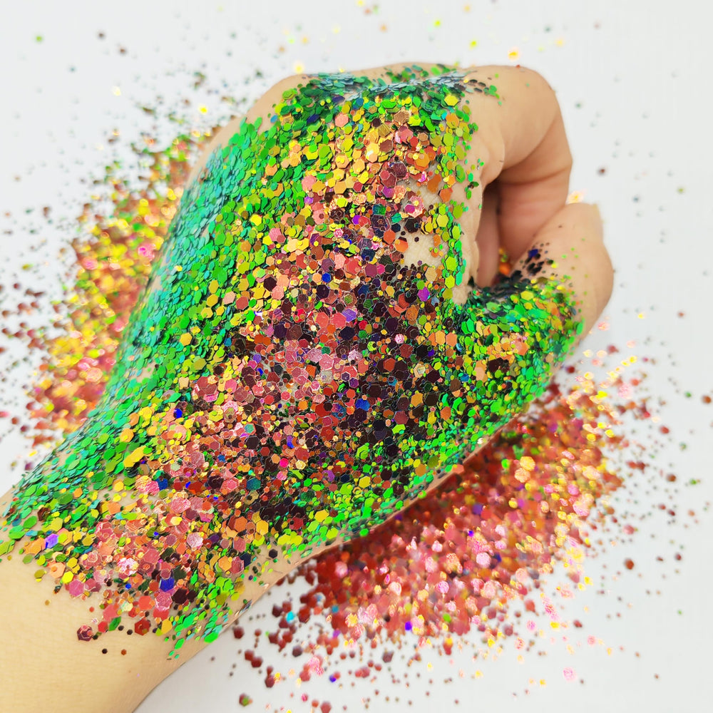 Generic chameleon glitter next to ruler for scale showing jar size and travel-friendly benefit