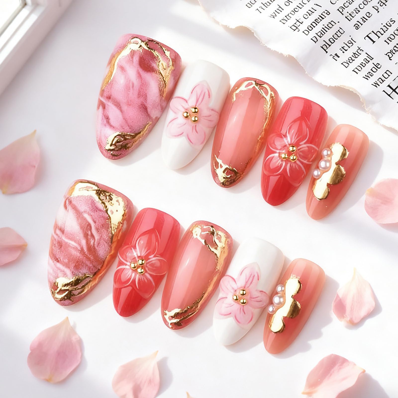 Generic close-up of 3D flower and gilded lines on almond nail, intricate detail