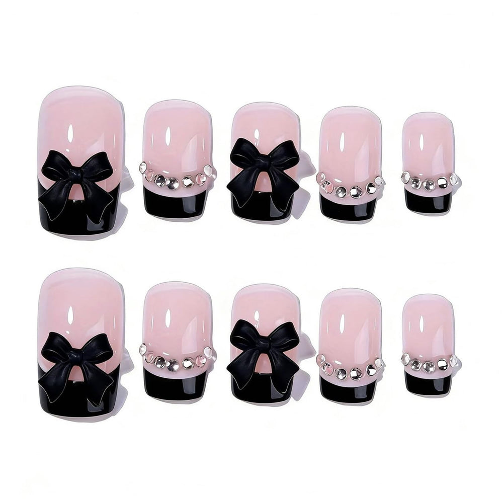 Generic close-up of bow rhinestone detail on nail, highlighting decorative sparkle and polish