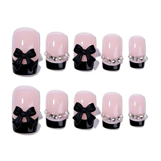 Generic close-up of bow rhinestone detail on nail, highlighting decorative sparkle and polish